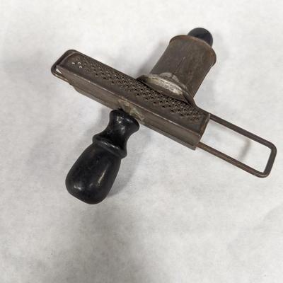 Nutmeg Grinder With Black Handles