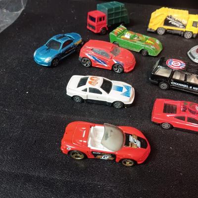 A VARIETY OF TOY CARS
