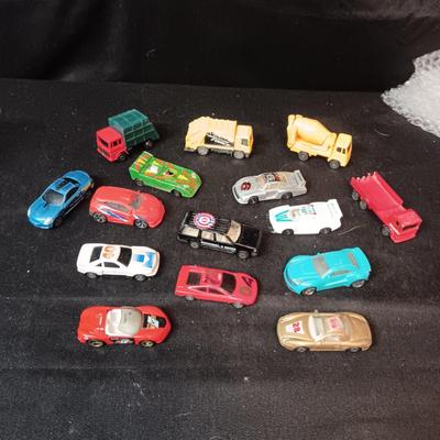 A VARIETY OF TOY CARS