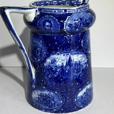 ROWLAND MARSELLUS HISTORICAL POTTERY PITCHER IN BLUE & WHITE WITH VIGNETTES OF VARIOUS HISTORICAL SCENES INCL WILLIAM PENNS TREATY,...