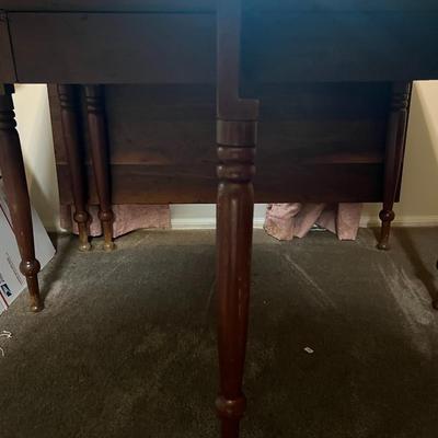 Vintage Wooden Drop Leaf Table 64" Long, 46" Wide, & 28.5" Tall in Good Preowned Condition.