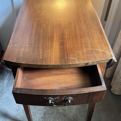 Antique Drop Leaf Oval Single Drawer Table as Pictured.