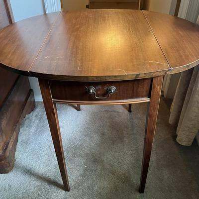 Antique Drop Leaf Oval Single Drawer Table as Pictured.