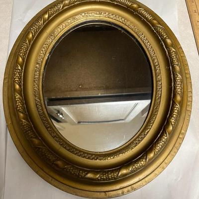 Antique Oval Gold Leaf Painted Mirror w/Wooden Back 12.25" Wide x 14.50" Tall in Good Preowned Condition.