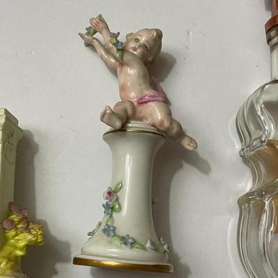 Vintage Lot of 3-Pieces; German Bust Bisque Statue, Italian Porcelain Cherub Figure, & Voilin Whiskey Glass Bottle as Pictured.