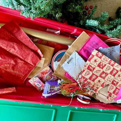Christmas greenery and a tub full of Christmas decorations