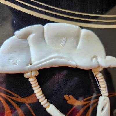 Carved Bone Bunny Pendant on carved beads