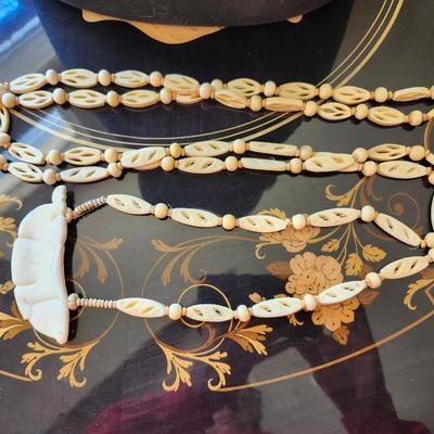 Carved Bone Bunny Pendant on carved beads
