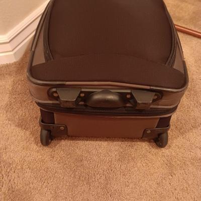 CASE LOGIC SUITCASE ON 2 WHEELS AND CARRY-ON PLUS A FOLDING LUGGAGE RACK