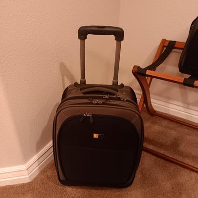 CASE LOGIC SUITCASE ON 2 WHEELS AND CARRY-ON PLUS A FOLDING LUGGAGE RACK