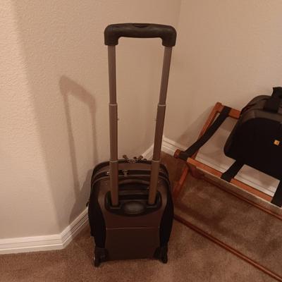 CASE LOGIC SUITCASE ON 2 WHEELS AND CARRY-ON PLUS A FOLDING LUGGAGE RACK