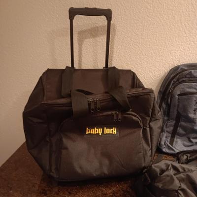 BABY LOCK CANVAS BAG ON 2 WHEELS, BACKPACK AND 2 SMALLER DUFFLE BAGS