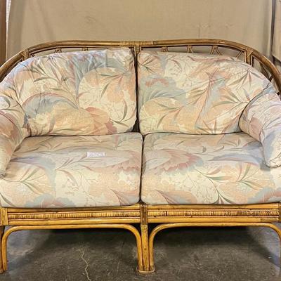 Ratan Loveseat with Floral Cushions