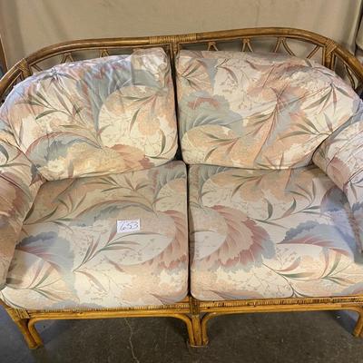 Ratan Loveseat with Floral Cushions
