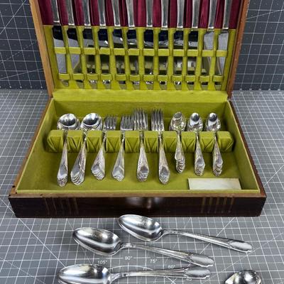 WM Rogers Silver Plated Set of Service for 12 with some serving. 