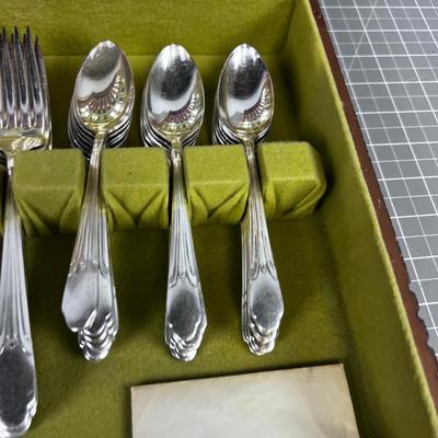 WM Rogers Silver Plated Set of Service for 12 with some serving. 