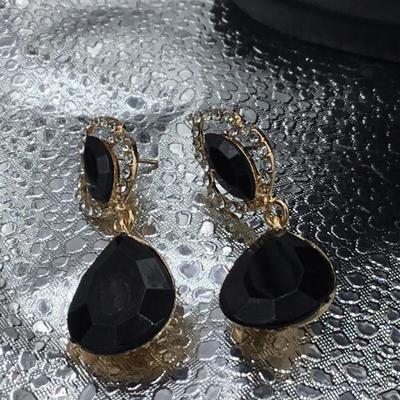 Gold tone rhinestone and black gem earrings