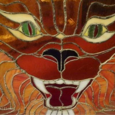 LOT 57: LARGE STAINED GLASS PANEL, LION HEAD, ON CLEAR, ONE OF A KIND