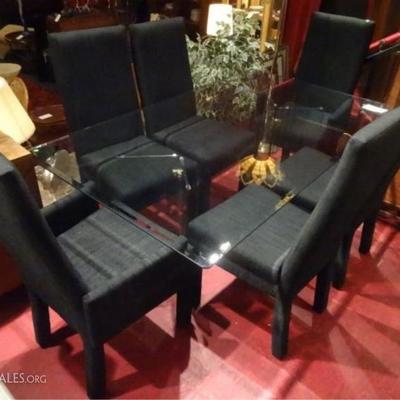 LOT 88: VINTAGE GLASS DINING TABLE & 6 BLACK UPHOLSTERED PARSONS CHAIRS