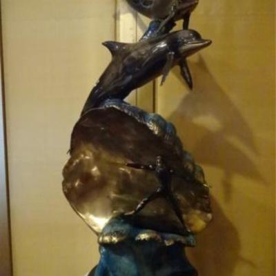 LOT 145: LARGE PATINATED BRONZE SCULPTURE, DOLPHINS AND SURFER