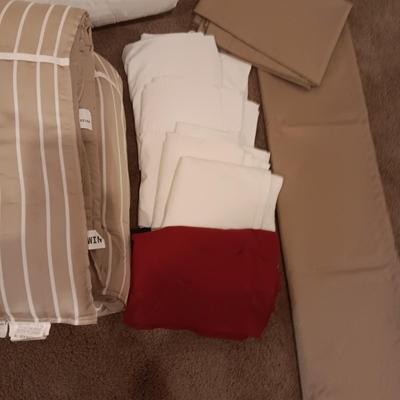 TWIN COMFORTER, BEDSKIRT, MATTRESS PADS, SHEETS AND 2 PANELS OF BLACKOUT CURTAINS