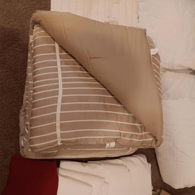 TWIN COMFORTER, BEDSKIRT, MATTRESS PADS, SHEETS AND 2 PANELS OF BLACKOUT CURTAINS