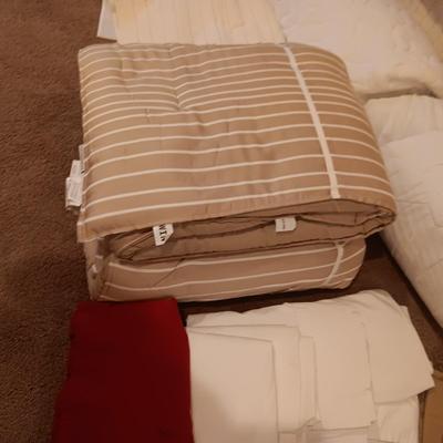 TWIN COMFORTER, BEDSKIRT, MATTRESS PADS, SHEETS AND 2 PANELS OF BLACKOUT CURTAINS