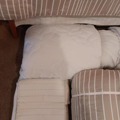 TWIN COMFORTER, BEDSKIRT, MATTRESS PADS, SHEETS AND 2 PANELS OF BLACKOUT CURTAINS