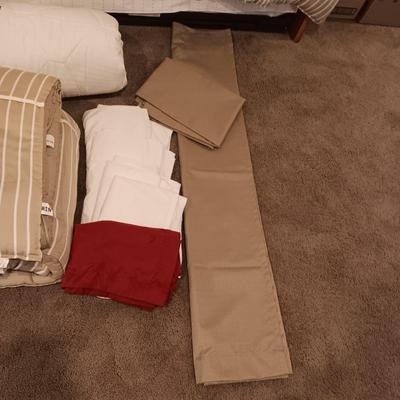 TWIN COMFORTER, BEDSKIRT, MATTRESS PADS, SHEETS AND 2 PANELS OF BLACKOUT CURTAINS