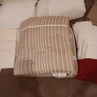 TWIN COMFORTER, BEDSKIRT, MATTRESS PADS, SHEETS AND 2 PANELS OF BLACKOUT CURTAINS