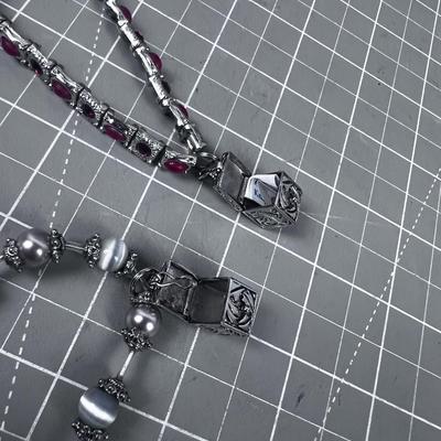 2 Bracelets with boxes that open on them 