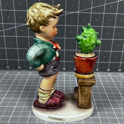 HUMMEL Titled: Confidentially  Boy and a Plant