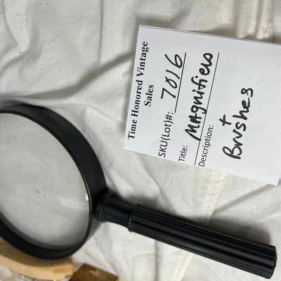 Brushes and magnifying glasses