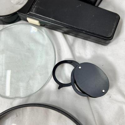 Brushes and magnifying glasses