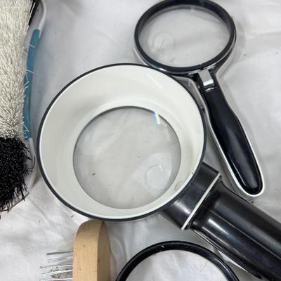 Brushes and magnifying glasses