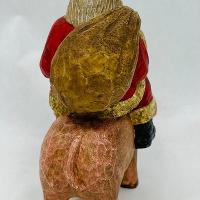 Santa Riding Pig Figurine
