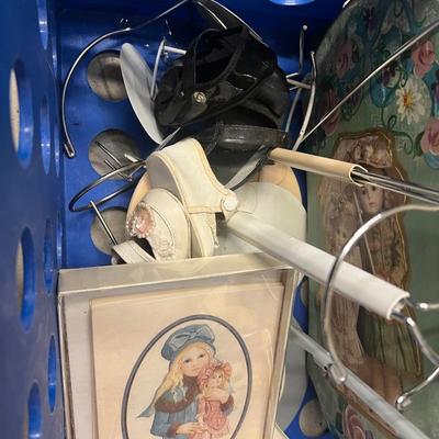 Blue crate with doll books and supplies
