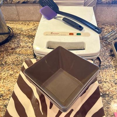 Zebra plates and bowls, waffle maker, and utensils
