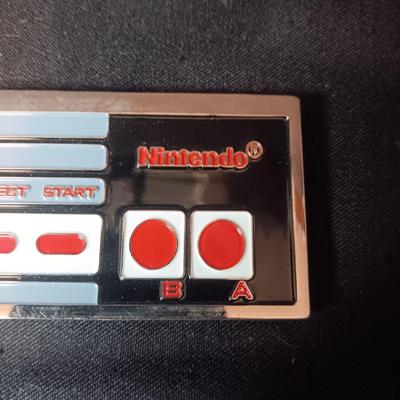 SCHLITZ AND NINTENDO BELT BUCKLES