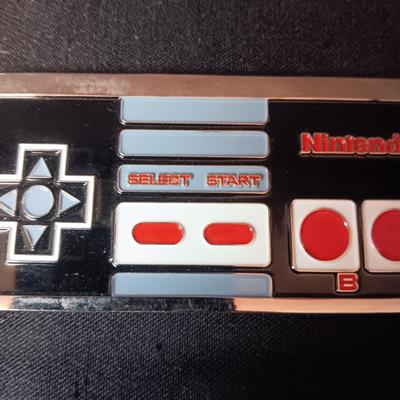SCHLITZ AND NINTENDO BELT BUCKLES