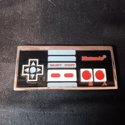 SCHLITZ AND NINTENDO BELT BUCKLES