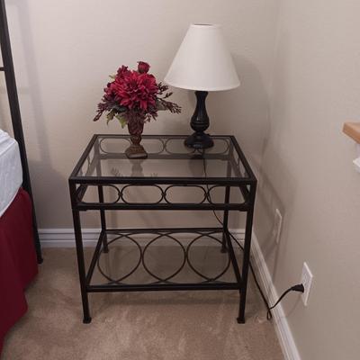 2 TIER IRON FRAME SIDE TABLE WITH GLASS TOP, SMALL LAMP AND SILK FLOWERS