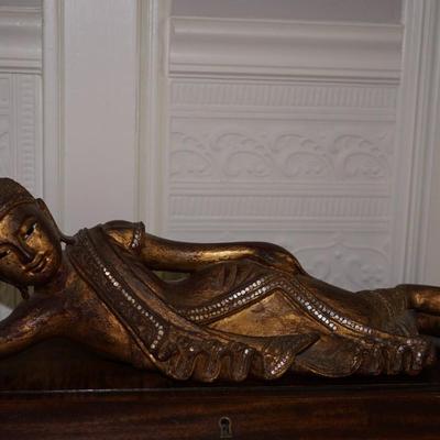 BURMESE RECLINING NAT OF CARVED WOOD AND GILDED FINISH