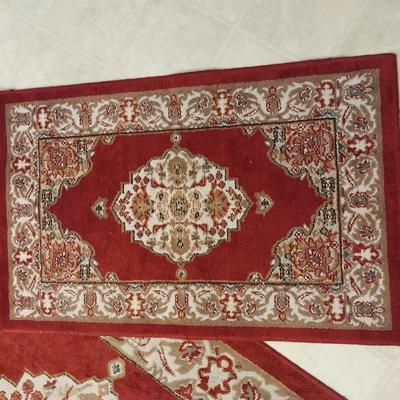 TWO MATCHING BATH RUGS