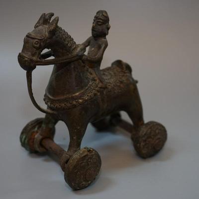 BURMESE /INDIA SOLID BRONZE ANTIQUE FIGURE ON HORSE. WITH WHEELS.