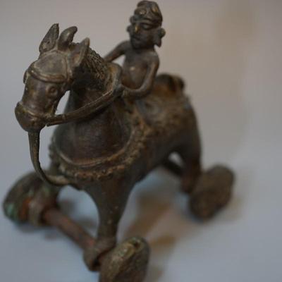 BURMESE /INDIA SOLID BRONZE ANTIQUE FIGURE ON HORSE. WITH WHEELS.