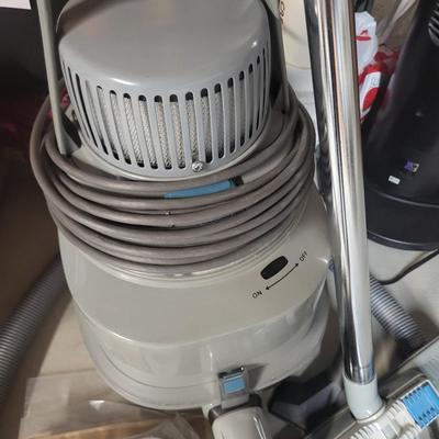 NILFISK CANISTER VACUUM WITH POWER HEAD AND ATTACHMENTS