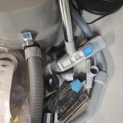 NILFISK CANISTER VACUUM WITH POWER HEAD AND ATTACHMENTS