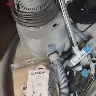 NILFISK CANISTER VACUUM WITH POWER HEAD AND ATTACHMENTS
