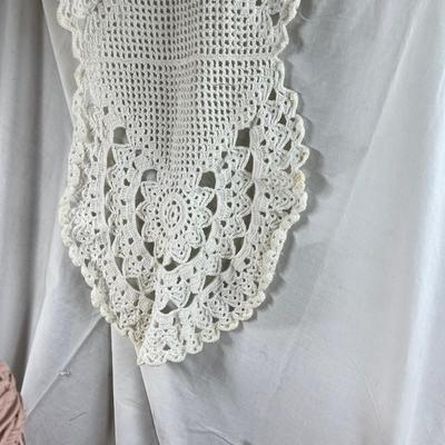 Mid century pink woven hamper and vintage linens